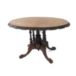 A Victorian walnut and inlaid tilt top loo table, the oval top inlaid with with birds, chalices