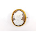 A Victorian oval cameo brooch, set in yellow metal, bust portrait of a lady with vines in her