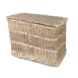 A large wicker and metal bound basket, 80cm H, 104cm W, 64cm D.