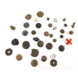 Metal detecting finds, to include military buttons, badges and brooches. (qty)