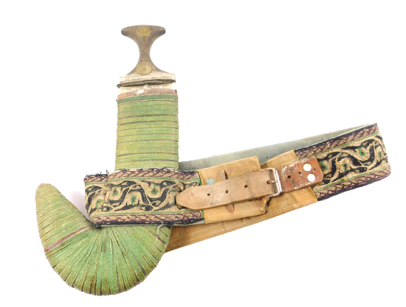 A Yemeni Jambiya, the horn hilt with metal embellishments, double edged steel blade and Asib leather