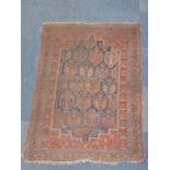 A Turkish design rug, with multi gul central field on a blue ground enclosed by a red border with