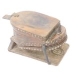 An industrial oak and leather bellows, with metal strap and stud work, and cast iron foot pedal,