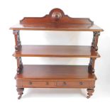 A Victorian mahogany buffet, with three shelves supported by foliate carved fretwork ends, above a