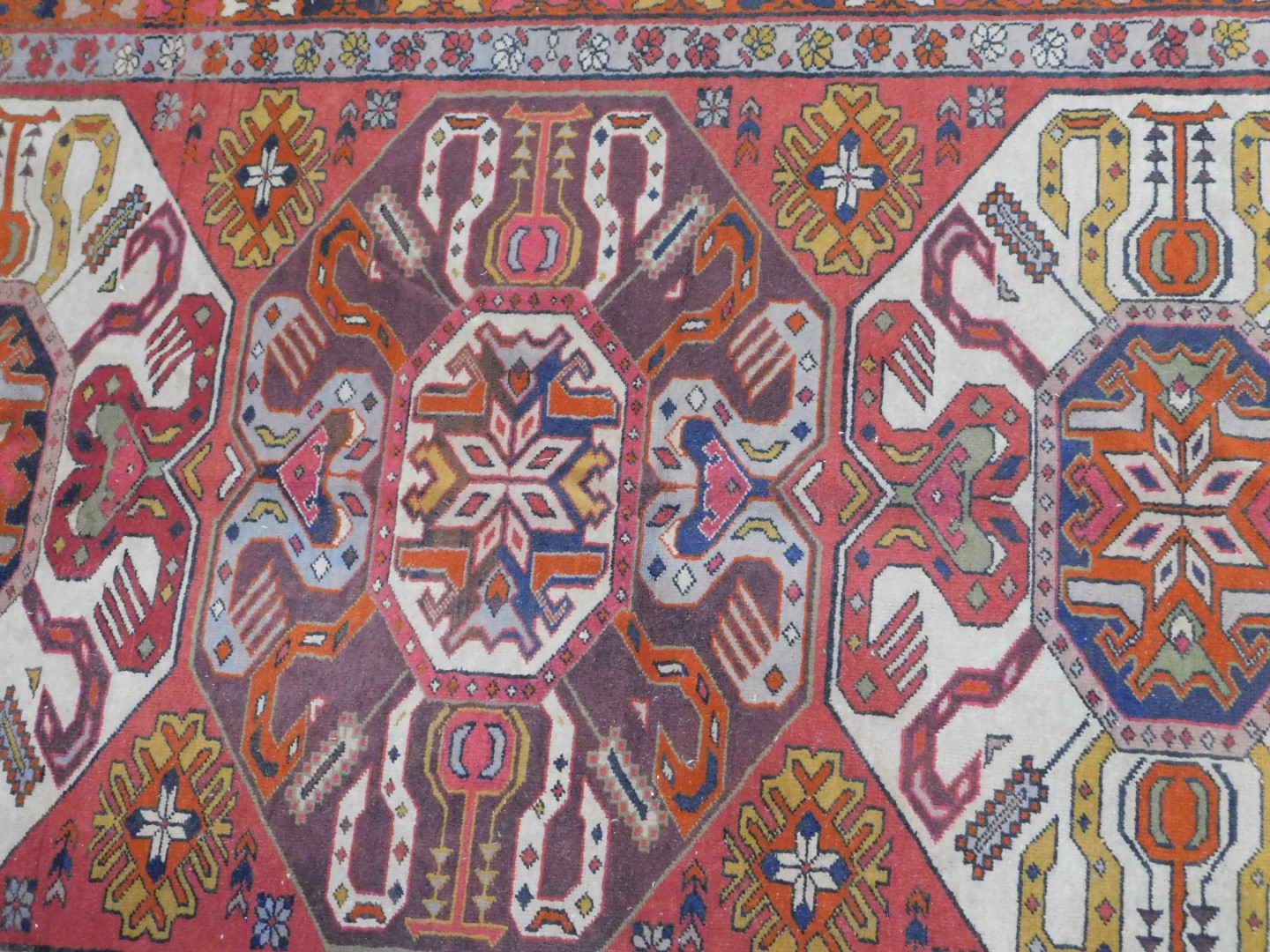 An Azerbaijan Kazak rug, with three central medallions on a red ground, enclosed by triple borders - Image 2 of 4