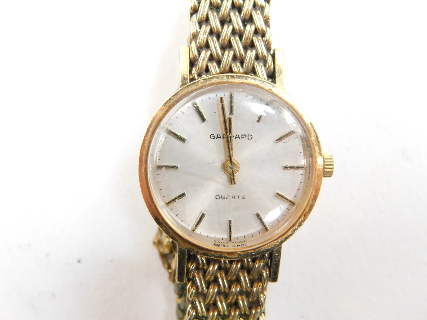A Garrard lady's 9ct gold cased wristwatch, circular silver dial with gilt batons, on a gold - Image 2 of 3