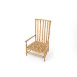 A Morris and Co. for Liberty Arts and Crafts style oak nursing chair, with wavy lath back,