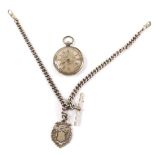 A late 19thC lady's pocket watch, open face, key wind, white metal dial with floral engraving,