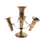 A George V silver three branch epergne, with a central trumpet and three removable trumpets,