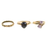A 9ct gold band, size M, 9ct gold and cat's eye cabachon ring, size R, and a 9ct gold and gem set