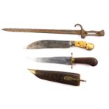 A 19thC hunting knife, possibly Indonesian with an engraved steel blade, and carved ivory and