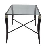 A Modernist cast metal square occasional table, inset glass top, raised on four tusk form legs