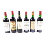 Three bottles of Chateau Vieux-Garrouilh Saint-Emilion 1992, together with a bottle of Puissegeuin-