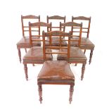 A set of six Victorian mahogany dining chairs, with foliate carved crest rail, two step ladder back,
