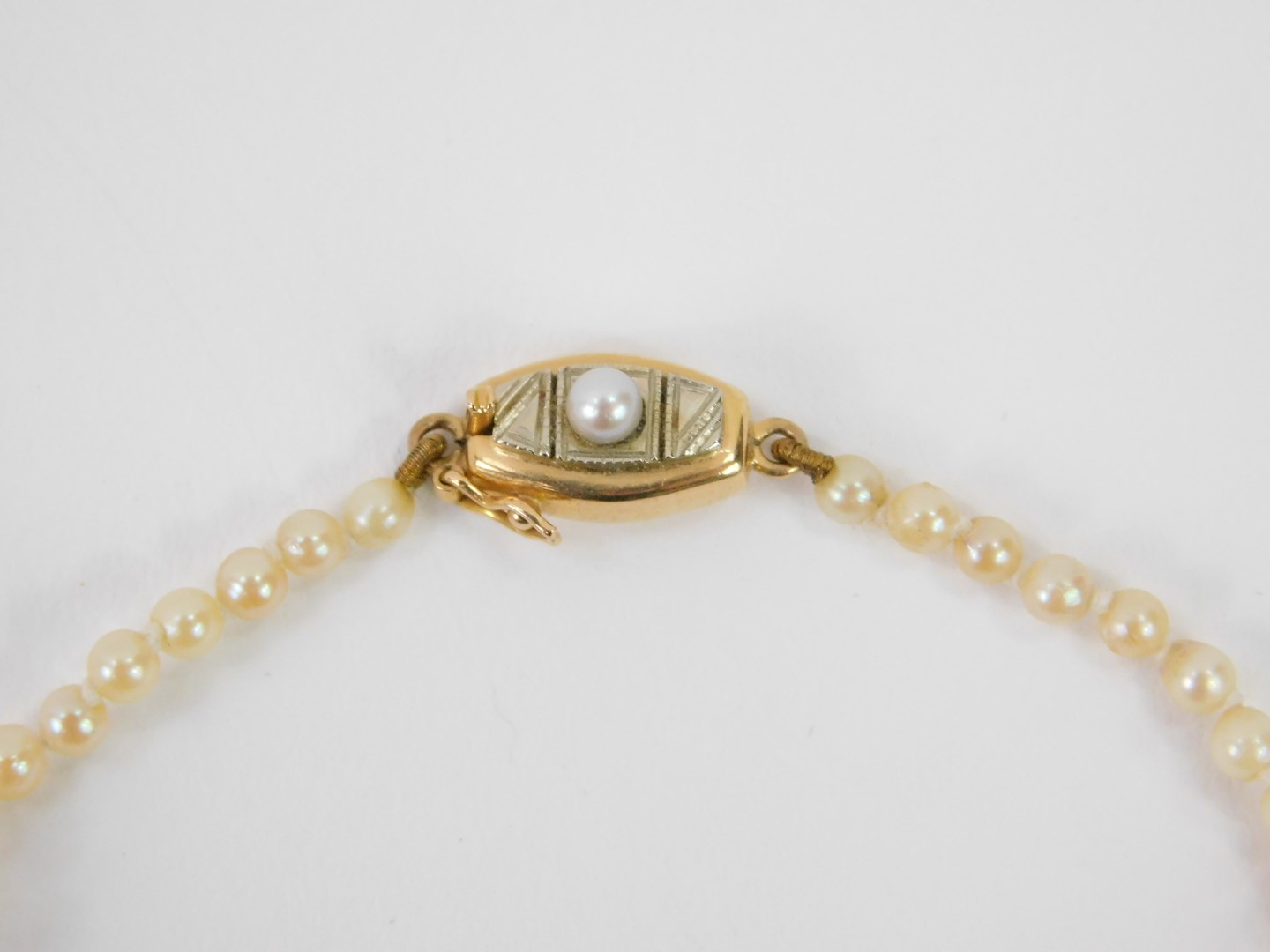 A string of graduated cultured pearls, on a 9ct gold and pearl set snap clasp. - Image 2 of 3