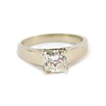 A diamond solitaire ring, set with a princess cut diamond, measuring 5.9mm x 5.92mm, total carat
