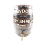 A Mendoza oak and cast iron bound dry sherry barrel, with brass tap, advertising a schooner at 3s