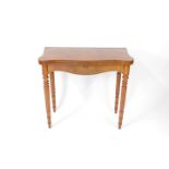 A burr walnut serpentine fold over tea table, raised on turned and fluted legs, 77cm H, 84cm W, 42cm