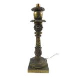 A French Second Empire bronze table lamp, polished out, cast with floral and foliate motifs,