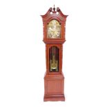 A Wai Hing Clocks Company hardwood cased long case clock, brass break arch dial, with decorative