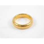 A 22ct gold wedding band, size J, 9.2g.