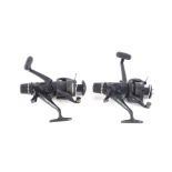 A pair of Shimano Baitrunner Aero 5000RE fishing reels.