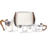 A Picquot ware five piece tea set, comprising twin handled tray, teapot, hot water jug, cream jug