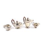 A George V silver four piece tea and coffee service, of baluster form, with fluted banding, shell