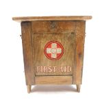 A Cuxson Gerrard & Company Ltd pine first aid cabinet, with a drop down front, opening to reveal two