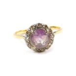 A Victorian amethyst and diamond ring, set with a pale rose cut amethyst, in a surround of diamonds,