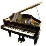 A John Broadwood & Sons ebonised baby grand piano, iron framed and over strung, raised on turned