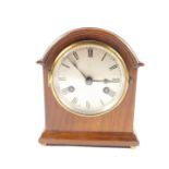 An early 20thC mahogany cased mantel clock, circular silvered dial bearing Roman numerals,