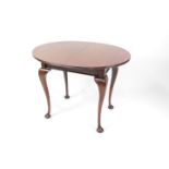 A Victorian mahogany occasional table, with a fluted oval top, raised on cabriole legs, 73.5cm H,