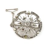 A silver marcasite and seed pearl set circular brooch, of the Art Deco design, set with design of
