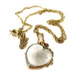 A gold plated and imitation rock crystal pendant, of heart shaped form, on Byzantine chain, the
