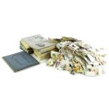 A large quantity of loose cigarette cards, in albums, etc.