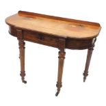 A 19thC side table by Gillows of Lancaster, with a raised back breakfront moulded top, above a