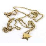 A modern pendant and chain, the star design pendant, on fine link chain, stamped 585, 1.9g.
