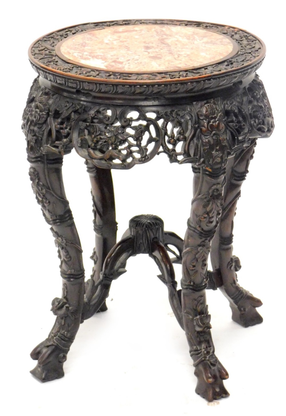A late 19th/early 20thC Chinese hardwood urn stand, the circular top carved with vines and