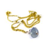 A modern Eastern style pendant and chain, with blue and clear ball design drop, the chain set with