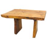 An oak small dining table, constructed from a slice of natural oak, on similar end supports, 74cm H,