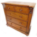 A Victorian mahogany chest of drawers, with two short, three long drawers, with turned wood handles,