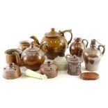 A collection of stoneware, to include a dark glazed teapot, small jar and cover, jug with side