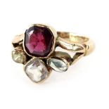 A multi stone set dress ring, set with various multi coloured stones, one white, one blue, green and