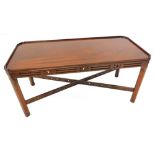 A mahogany galleried coffee table, with a pierced frieze, champhered legs and X shaped stretcher,