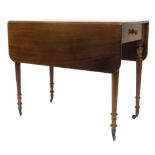 A 19thC mahogany Pembroke table, with a frieze drawer on turned tapering legs with castors, 88cm W.