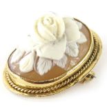 A 9ct gold cameo brooch, the raised cameo with carved rose, in a yellow metal frame, with rope twist