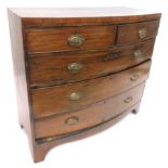 An early 19thC mahogany bow fronted chest of drawers, the caddy top above a two short and three long