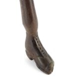A 19thC hardwood Sunday type walking stick, the handle carved as a boot, (AF), 97cm L.