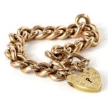 A 9ct gold rose gold charm bracelet, with heart shaped padlock, on belch link chain with safety